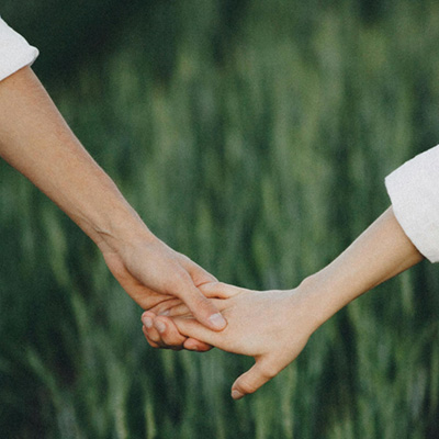 Two people shaking hands after resolving a conflict